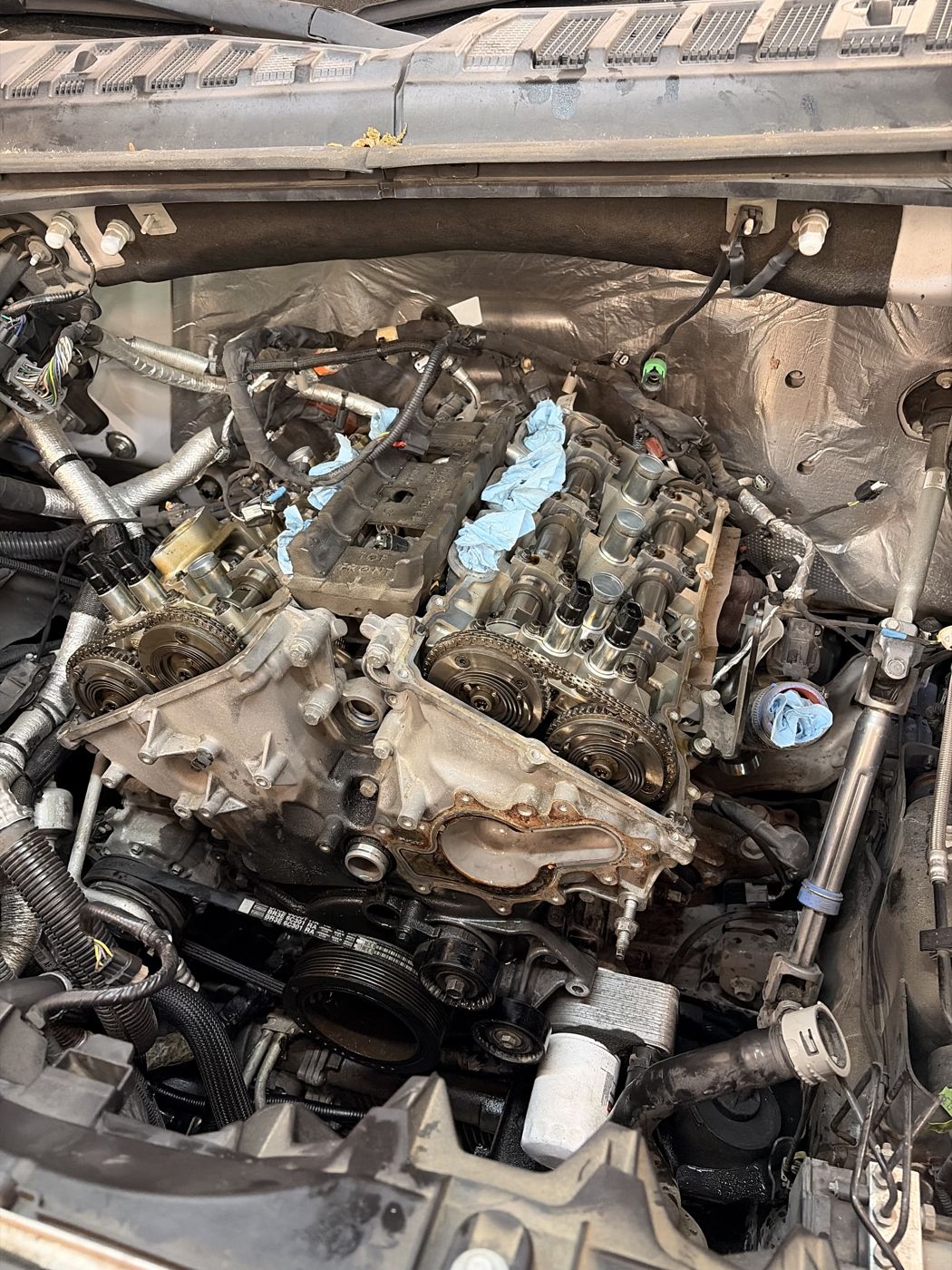 V6 engine with both valve covers removed, camshafts and cam phasers exposed